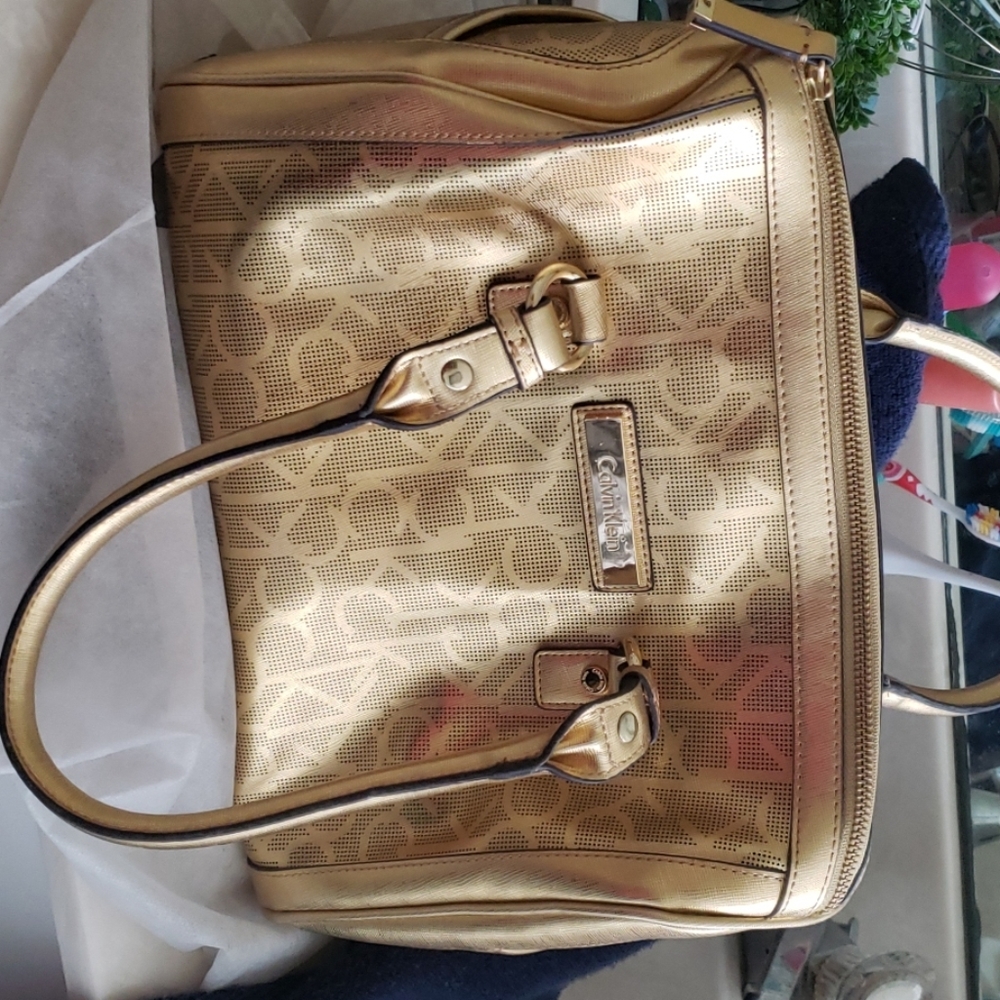 Gold hand bag